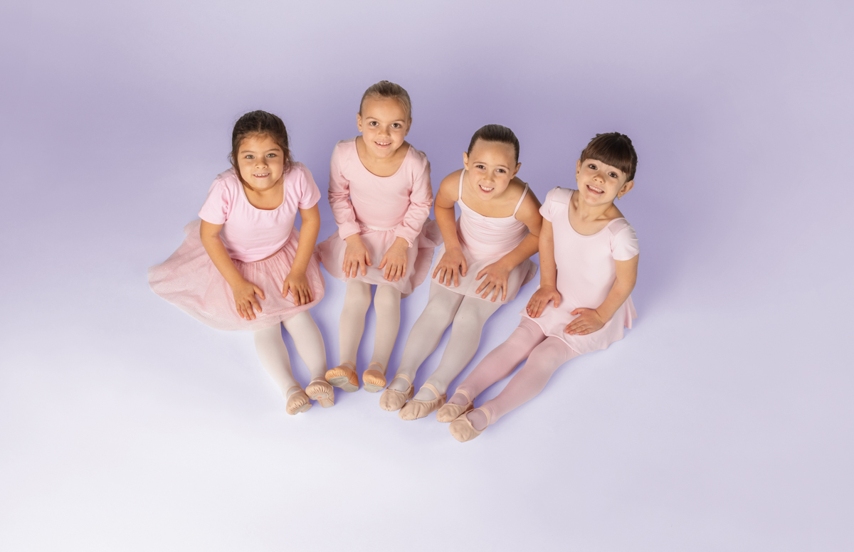 Ottawa Dance Centre School - Four young recreational ballet dancers sitting